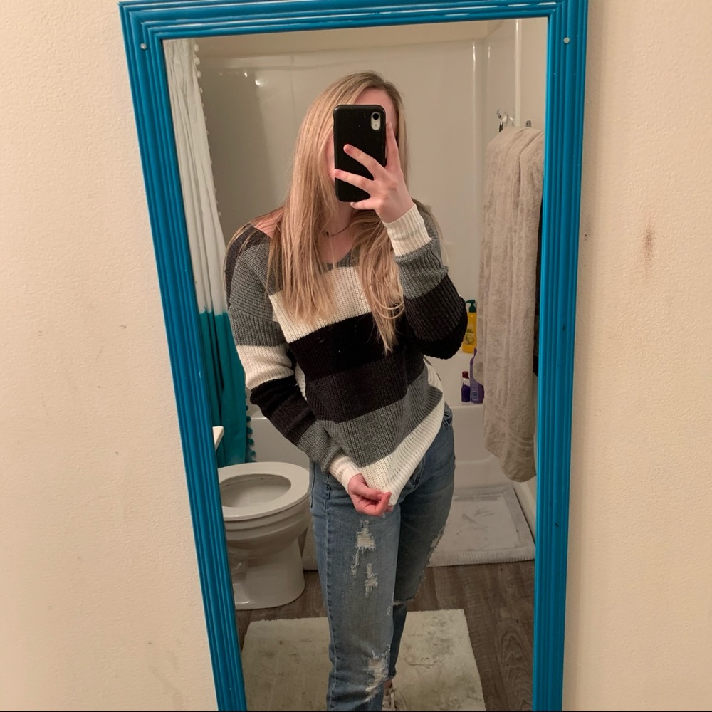 black, white, and grey sweater
